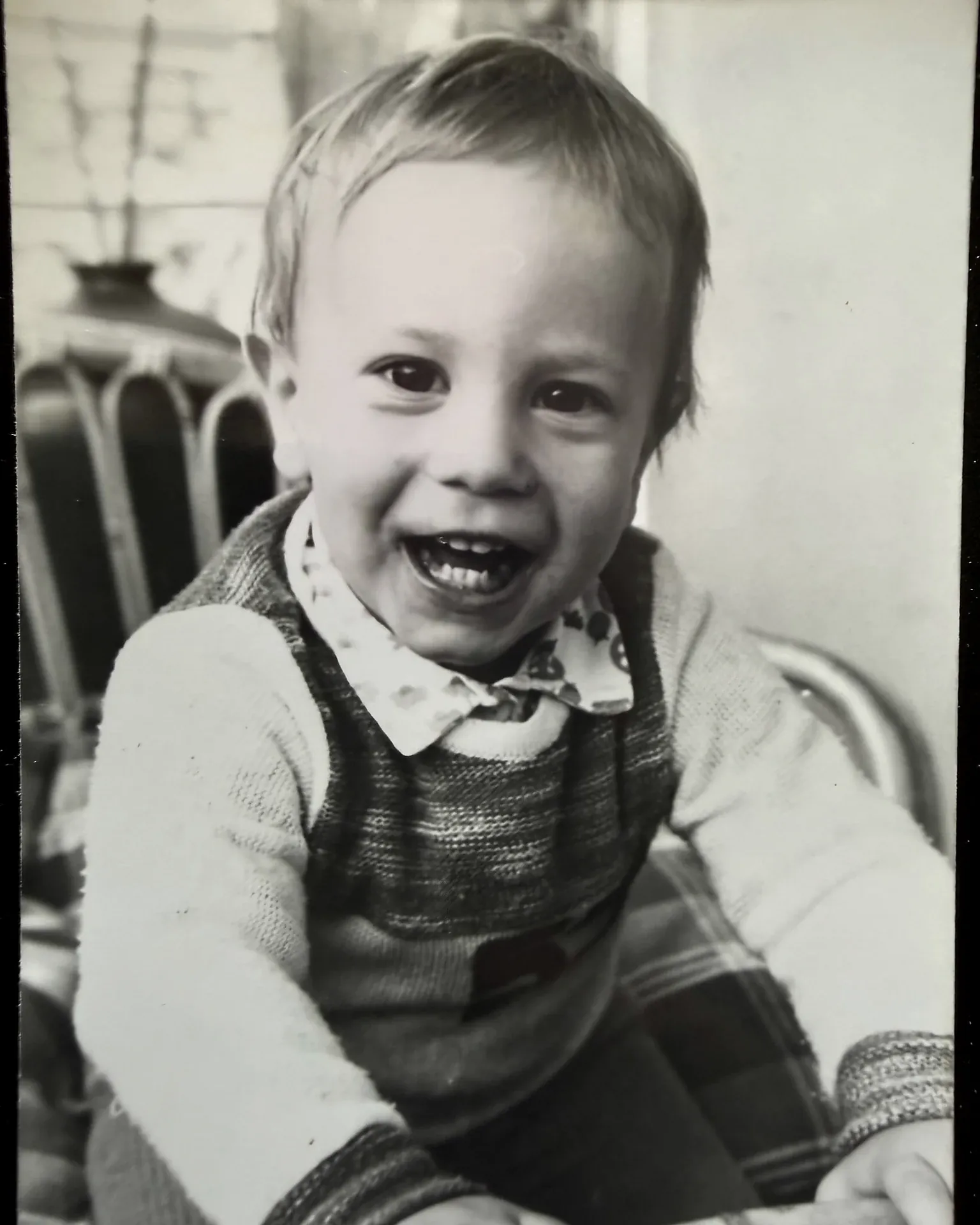 Armin Rogl as a small child, laughing, black and white archive photo